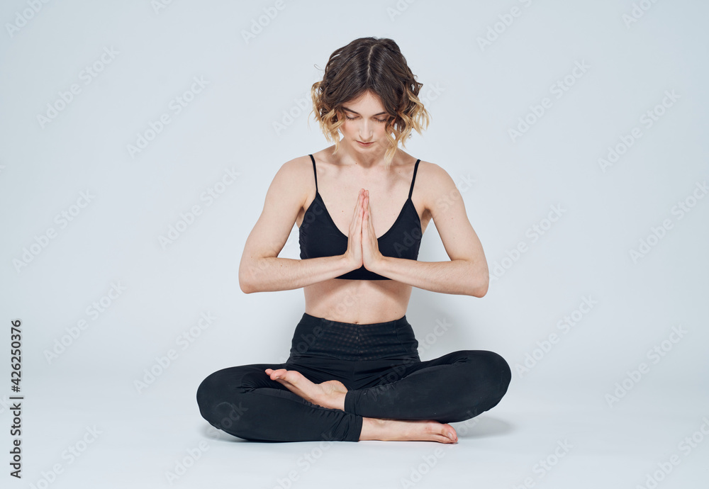 Sporty man meditating sitting in cross-legged yoga lotus pose Stock Photo  by koldunov