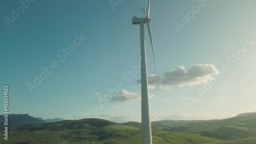 Wind turbine at Ardales, south of Spain. Drone slowly moving up photo