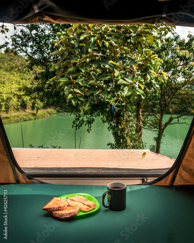 Breakfast in a camping tent overlooking the lake