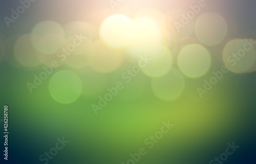 Bokeh flares on green glass matte textura abstract pattern. Glowing toned background.