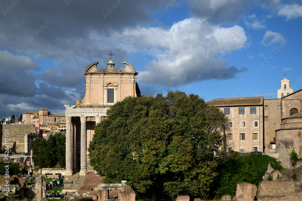 cloudy cityscape over roman forum - Antoninus and Faustina Temple (now San Lorenzo in Miranda church) - Rome, Lazio, Italy