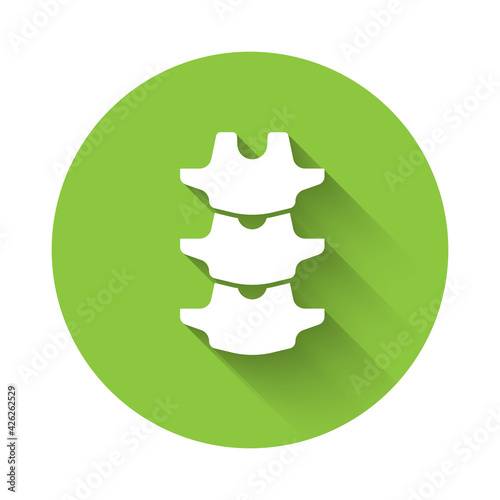 White Human spine icon isolated with long shadow. Green circle button. Vector