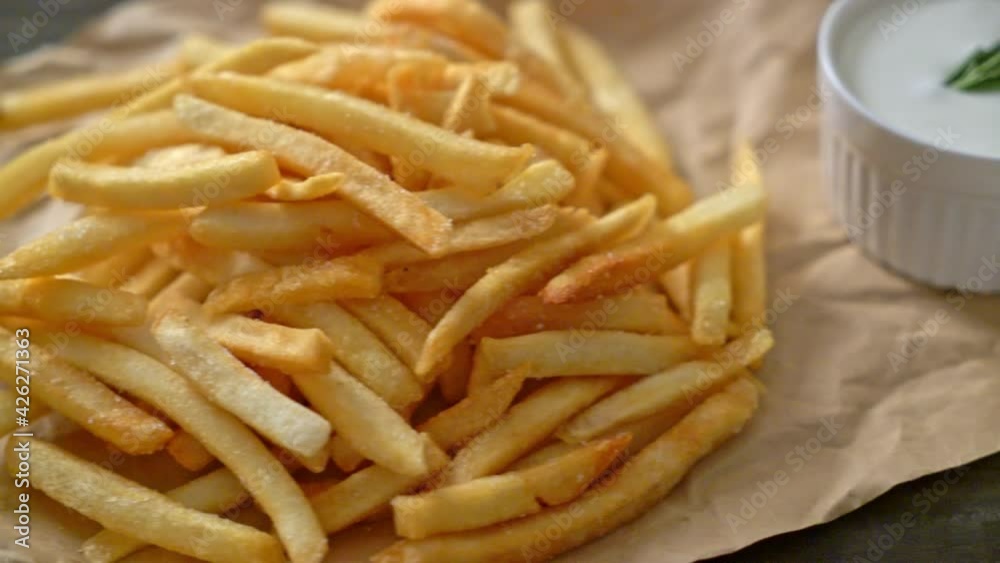 French fries or potato chips with sour cream and ketchup French fries or potato chips with sour cream and ketchup