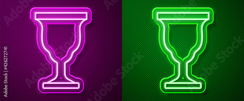 Glowing neon line Christian chalice icon isolated on purple and green background. Christianity icon. Happy Easter. Vector