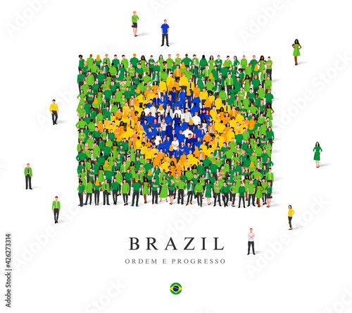 A large group of people are standing in green, yellow, blue and white robes, symbolizing the flag of Brazil.