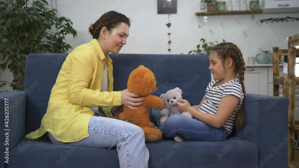 Happy family. Mom and daughter play home with teddy bear. Happy family in lockdown isolation. Mom and daughter play with teddy bear in isolation at home. Happy daughter teddy bear playing with mom Happy family. Mom and daughter play home with teddy bear. Happy family in lockdown isolation. Mom and daughter play with teddy bear in isolation at home. Happy daughter teddy bear playing with mom