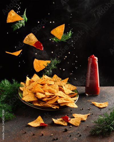 flying corn chips with pepper and salt. Levitation