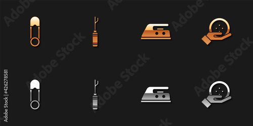 Set Safety pin, Awl tool, Electric iron and Sewing button icon. Vector