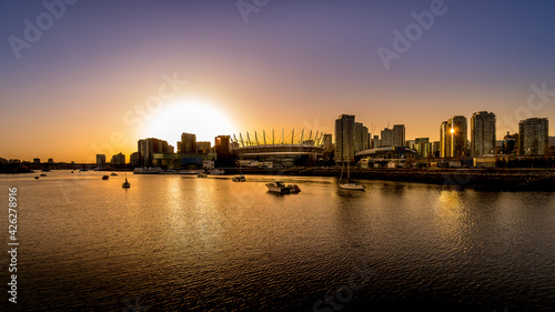 Sun setting over the Vancouver Skyline at the North Shore of False Creek  British Columbia  Canada