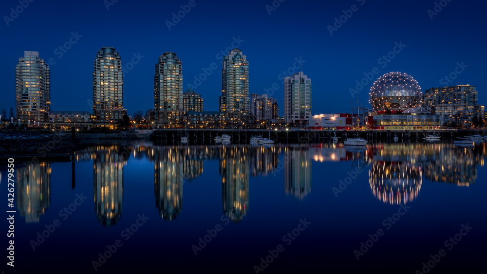 Vancouver Skyline at the Blue Hour with Lights on  the Science Center Globe at night on the Eastern Shore of False Creek Inlet, British Columbia, Canada
