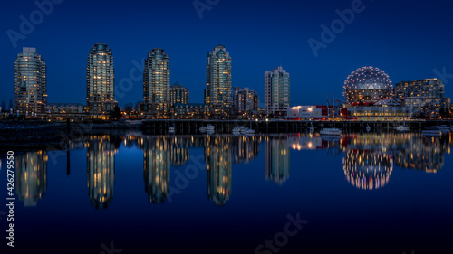 Vancouver Skyline at the Blue Hour with Lights on  the Science Center Globe at night on the Eastern Shore of False Creek Inlet, British Columbia, Canada