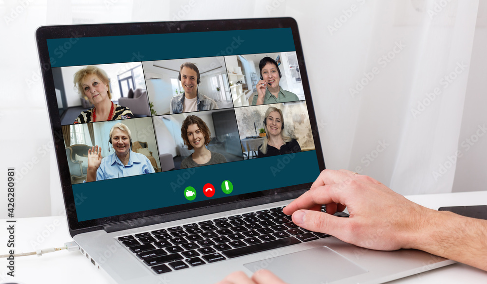 Virtual meeting online. Video conference by laptop. Online business meeting. On the laptop screen, people who gathered in a video conference to work on-line Virtual meeting online. Video conference by laptop. Online business meeting. On the laptop screen, people who gathered in a video conference to work on-line