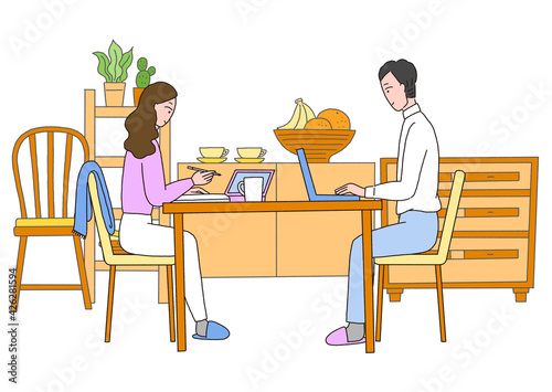 自宅リビングで仕事をしている男性と女性