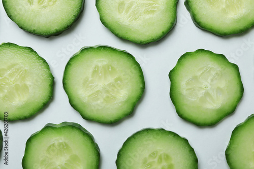 Ripe cucumber slices on white background, close up