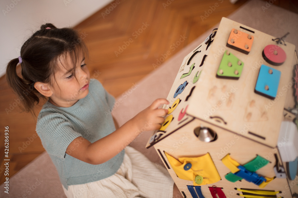 Toddler playing interactive games for good development at home. Toddler playing interactive games for good development at home.