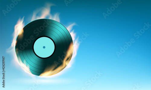 Vinyl music disc on fire. Background with place for text.
