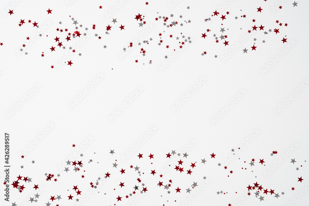 Red and white confetti stars on white background. Happy Canada Day banner design. Flat lay, top view, copy space.