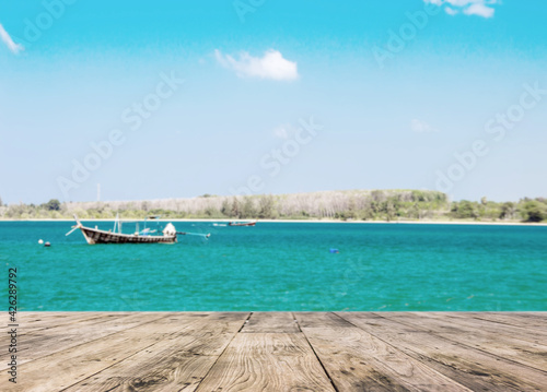 relax view with wood boat and clean sea in thailand
