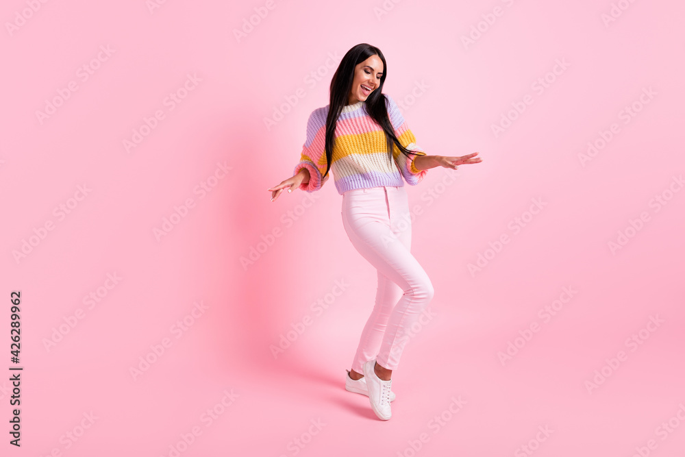 Full length photo of young cheerful girl happy positive smile excited crazy dance party isolated over pastel color background