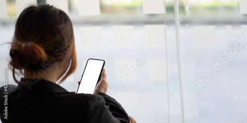 Free Download Close up business woman using smart phone with white blank screen at office - GFXLoad
