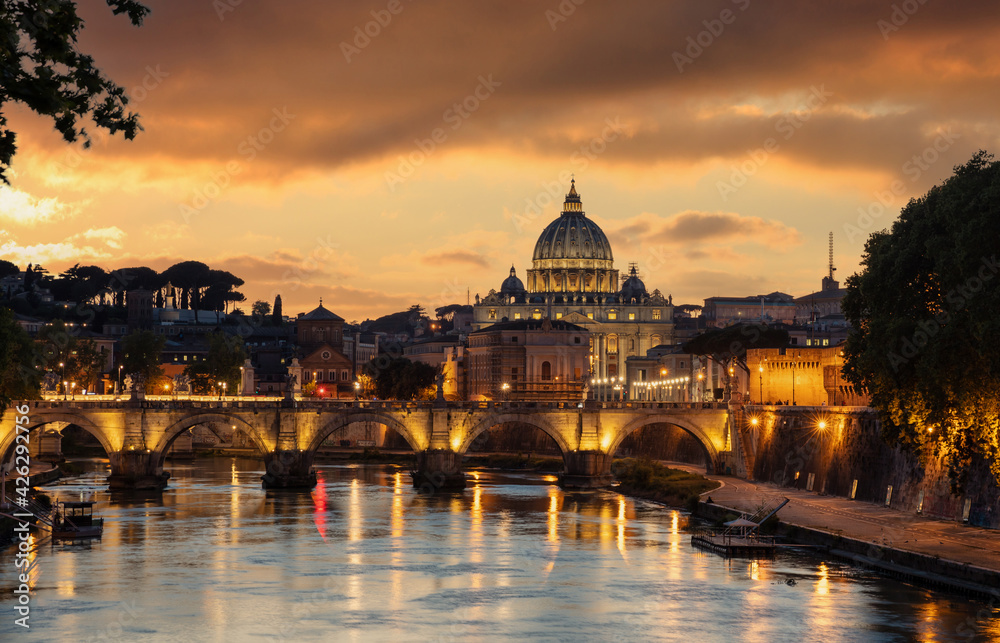 Rome Italy. San Pietro basilica in the Vatican, ponte Sant Angelo and Tiber river, sky at sunset