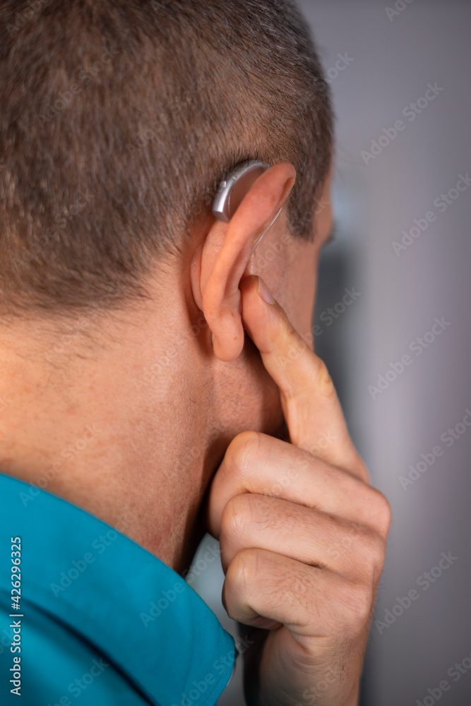 Hearing aid ear of man Hearing aid ear of man