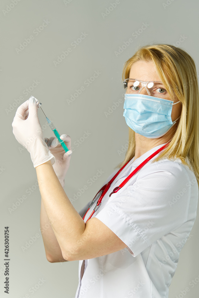 nurse holding vaccine and syringe, vaccination against the virus covid-19. vaccination against covid-19 for traveling and vaccine passport nurse holding vaccine and syringe, vaccination against the virus covid-19. vaccination against covid-19 for traveling and vaccine passport