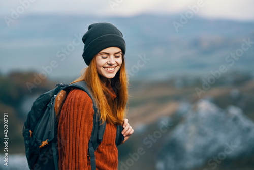 cheerful woman in nature mountains adventure travel walk