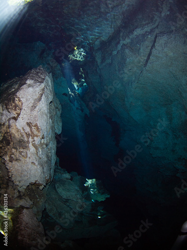 Slight sunbeams into underwater cave (Cenote Chikin Ha, Playa del Carmen, Quintana Roo, Mexico)