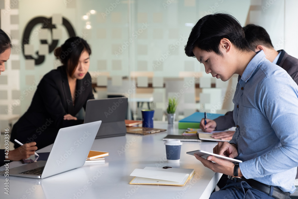 Group of Businessman and Accountant checking data document on digital tablet for investigation of corruption account . Anti Bribery concept Group of Businessman and Accountant checking data document on digital tablet for investigation of corruption account . Anti Bribery concept