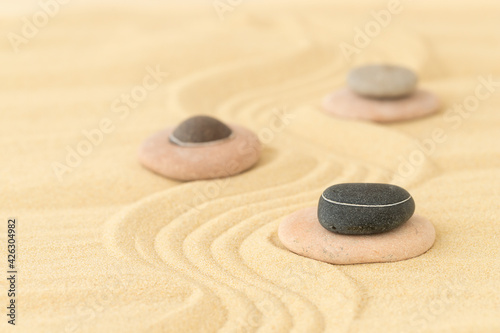 Stones on the sand - summer background for relaxation
