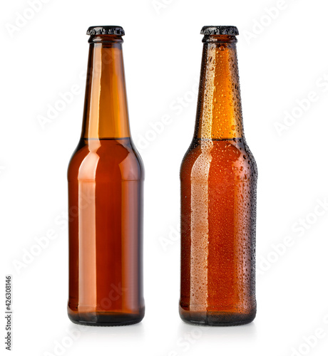 brown bottles with beer on white