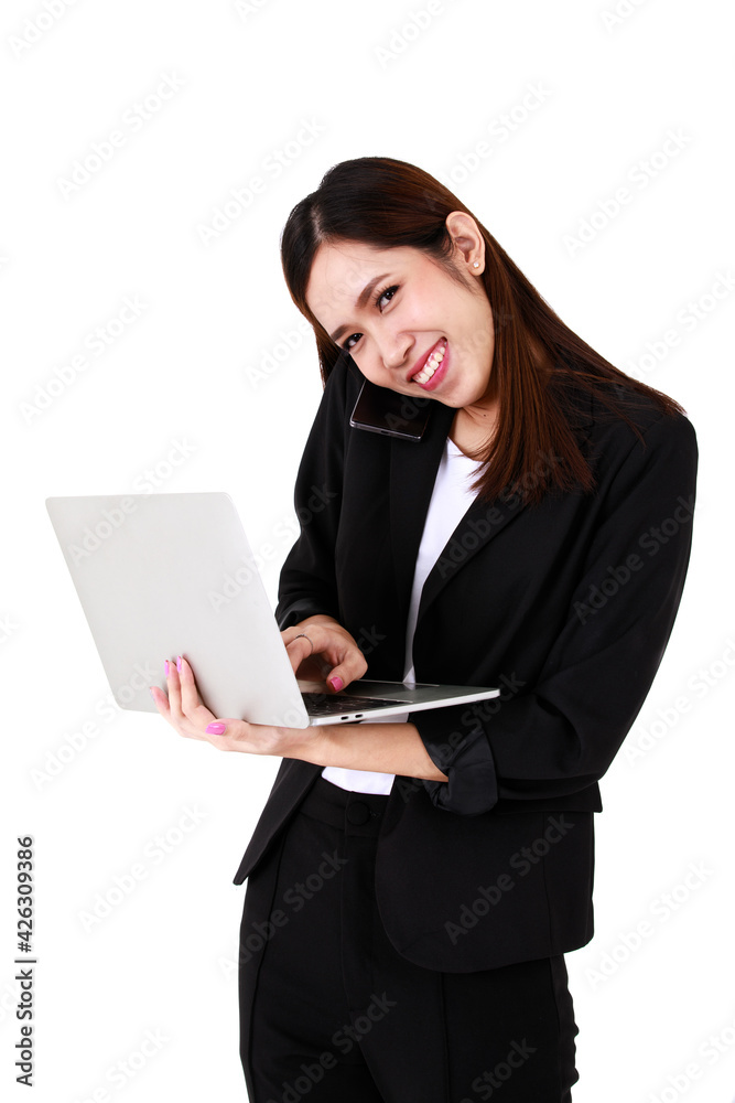 Asian young long brown hair pretty successful secretary businesswoman wears black formal suit hold gray laptop computer in hand stand smile look at camera when typing in front of white background Asian young long brown hair pretty successful secretary businesswoman wears black formal suit hold gray laptop computer in hand stand smile look at camera when typing in front of white background