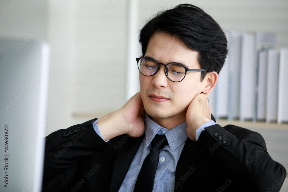 Asian young black short hair male employee worker wears formal suit with  necktie gray shirt and