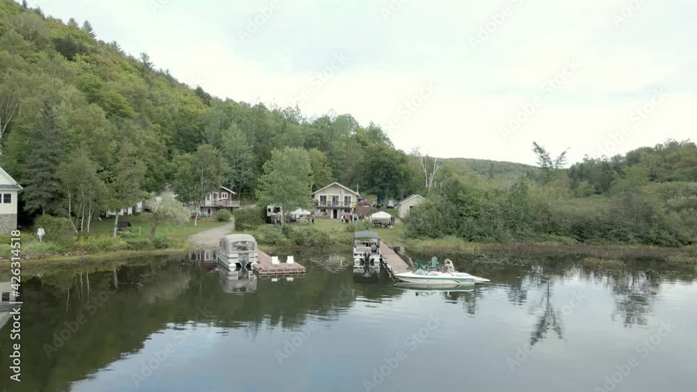 Aerial view of a group of people having a party near a lake on a cloudy day, Aerial view of a group of people having a party near a lake on a cloudy day,