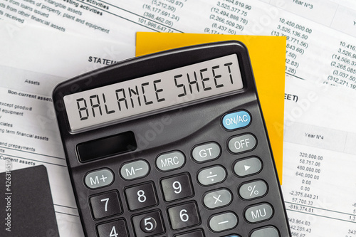 On display of calculator is written BALANCE SHEET