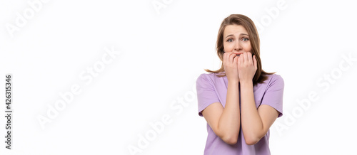 Shocked young woman covering her mouth with hands, isolated on white background. Place for your text