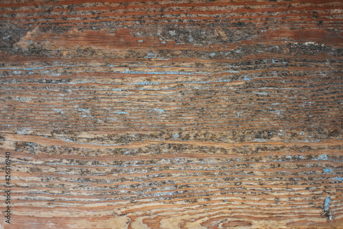 Old aged beaten brown wooden planks background texture