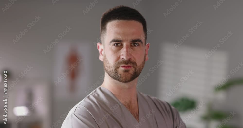 Portrait shot of a doctor in medical cabinet, looking at camera. Healthcare professional ensuring health and safety. Medicine, healthcare services 4k footage Portrait shot of a doctor in medical cabinet, looking at camera. Healthcare professional ensuring health and safety. Medicine, healthcare services 4k footage