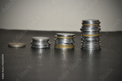 Wallpaper Mural Coins stacks with a growth multicolor graph on silver sparkling bokeh background. Financial growth concept.E Torontodigital.ca
