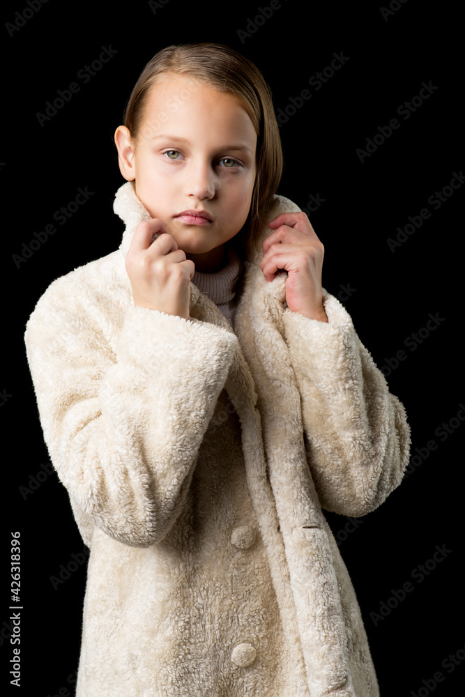 Pretty girl in fashionable outfit. Studio portrait. Pretty girl in fashionable outfit. Studio portrait.