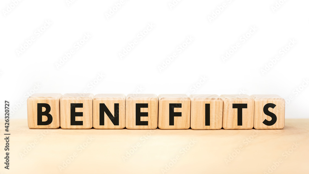 Text BENEFITS on wooden blocks on white background Text BENEFITS on wooden blocks on white background