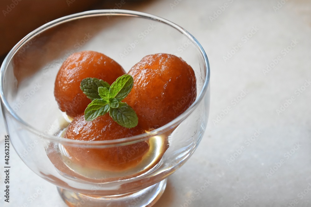 Indian Sweet food called Gulab Jamun made up of milk and sugar, a popular dish in festival or special occasion. Selective focus