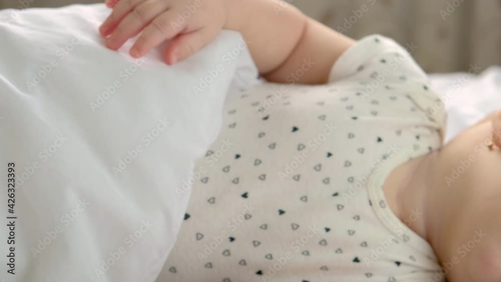 baby sleeps in a crib. selective focus. baby sleeps in a crib. selective focus.