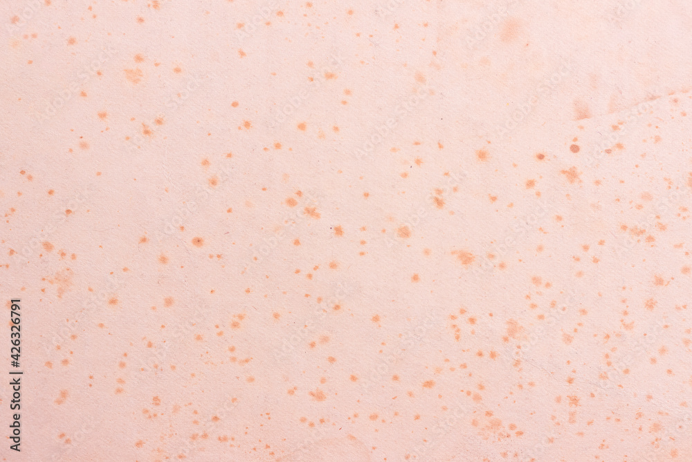 A sheet of old, worn cardboard, covered with stains and scratches. Simple light paper texture.