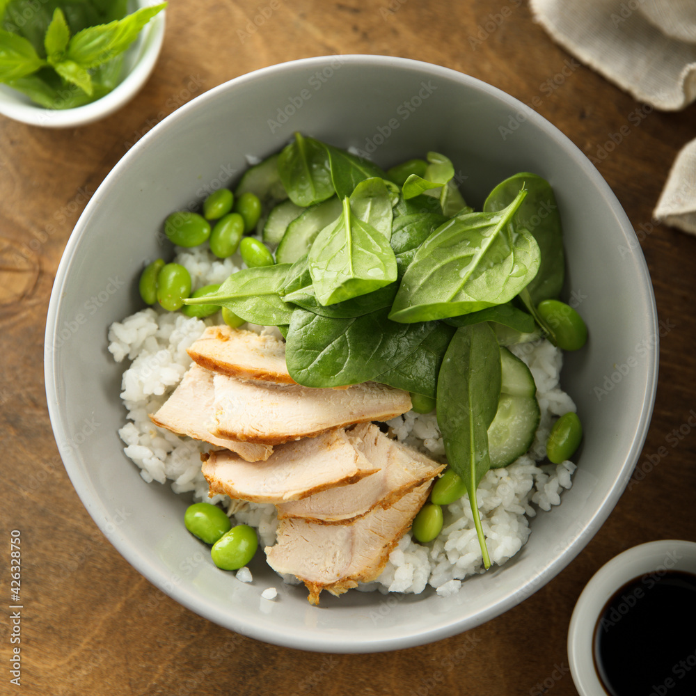 Healthy rice bowl with chicken and spinach Healthy rice bowl with chicken and spinach