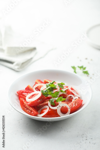 Healthy tomato salad with onion