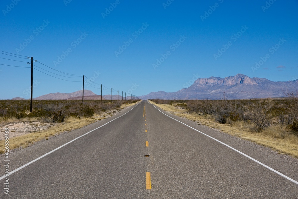 Endless desert road in West Texas USA 2