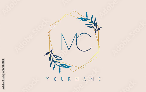 Letters MC m c Logo with golden polygon frames and gradient blue leaves design. photo