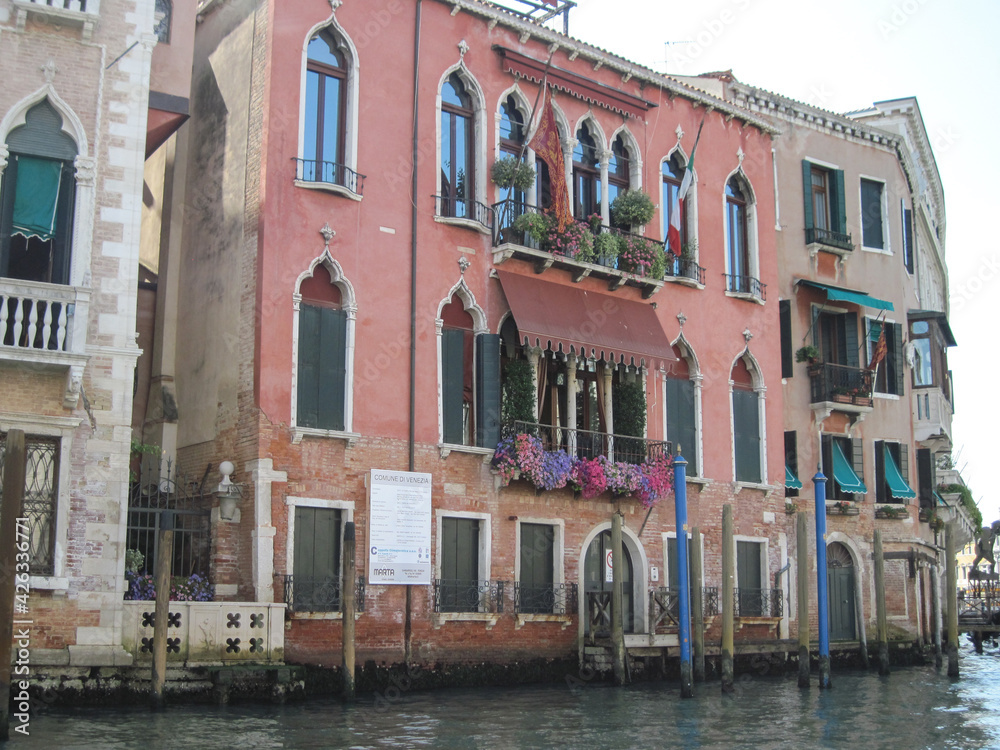Venice old city grand canal with gondolas and boats. Romantic swimming in the morning. Comfotrable transportation to ancient historic hotel. Scenic Venetian scape on a sunny day. Venice old city grand canal with gondolas and boats. Romantic swimming in the morning. Comfotrable transportation to ancient historic hotel. Scenic Venetian scape on a sunny day.